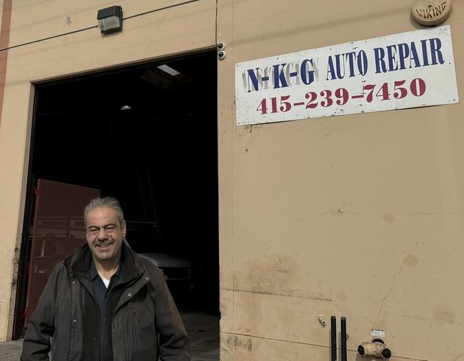 NKG Auto Repair shop entrance with the N-K-G Auto Repair sign and phone number
