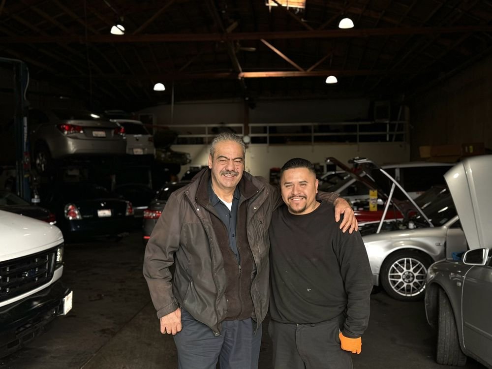 Two members of the NKG Auto Repair team inside the shop in Bayview-Hunters Point, San Francisco